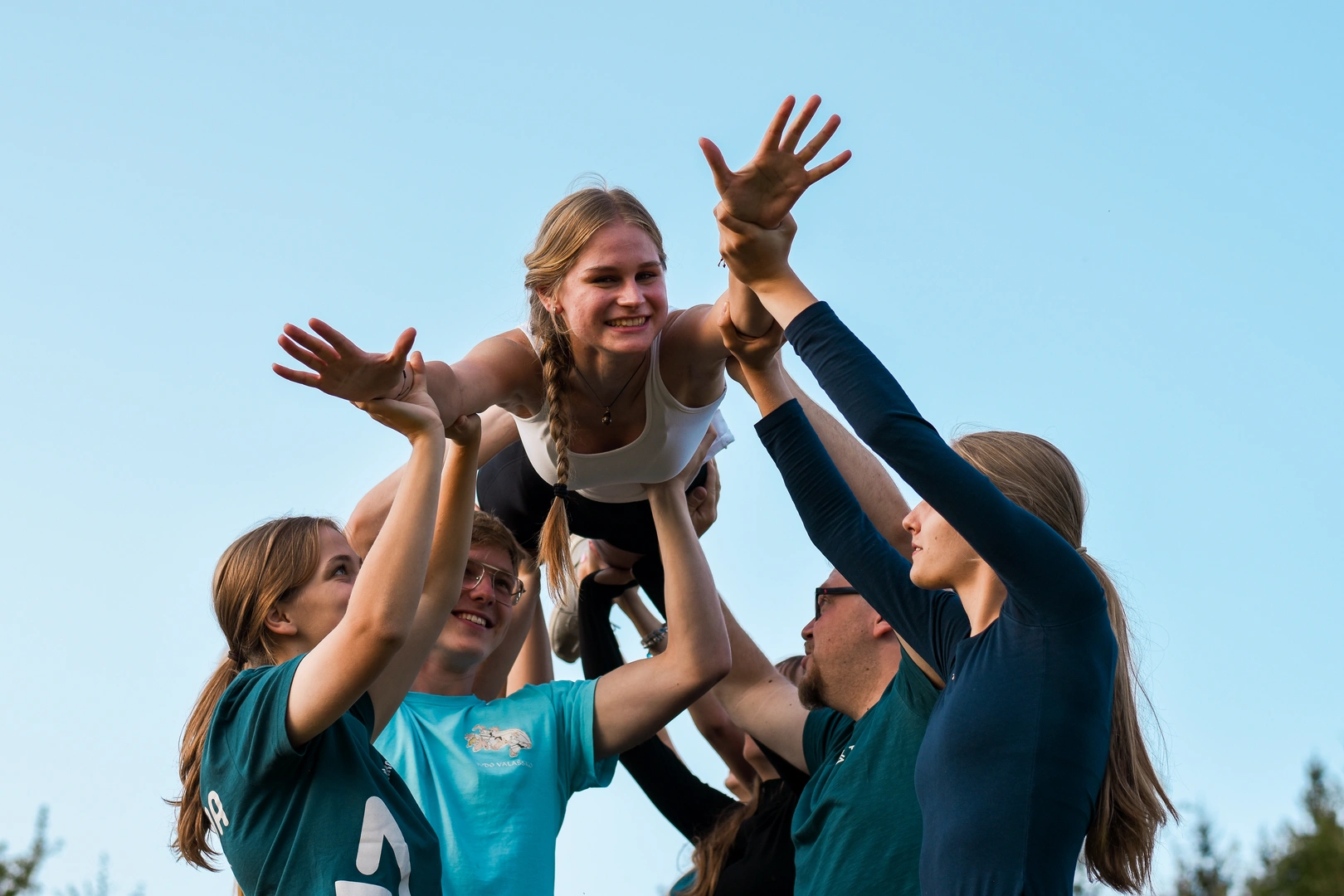 Child laughing with teacher