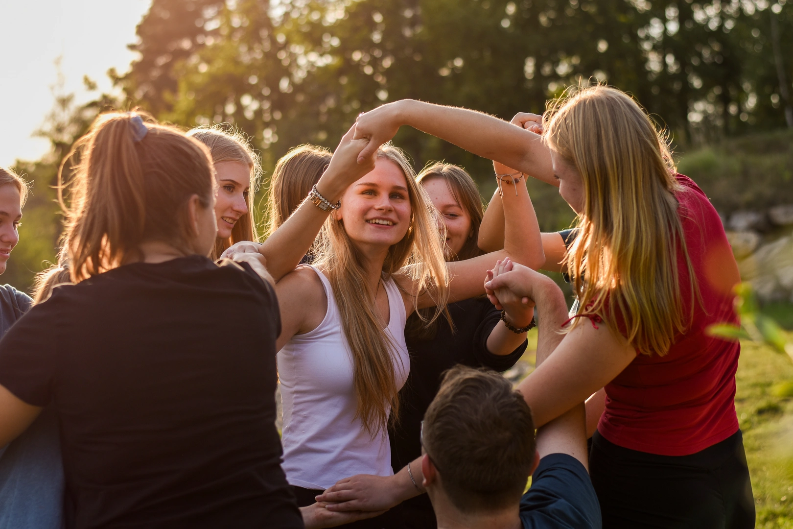 Child writing on board with teacher